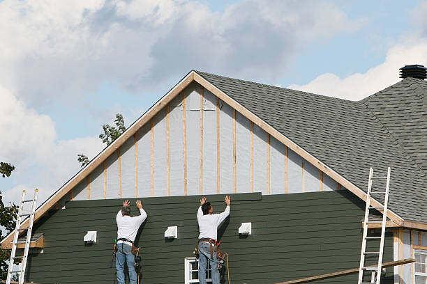 Professional Siding Contractor technician working in Dendron, VA